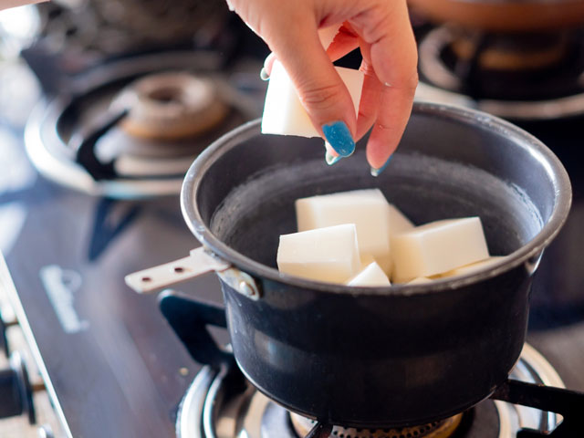 Melting solid-at-room-temperature oils to make cold process soap