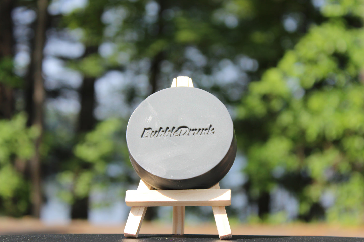 A handmade bar of soap that is black and in the shape of a hockey puck. Give Yer Balls a Scrub smells like men's cologne and was made from 100% organic oils.