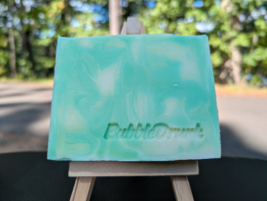 A handmade bar of soap that is swirled with green and white, and Pear scented.  Pear Some Sugar On Me was made from 100% organic oils.