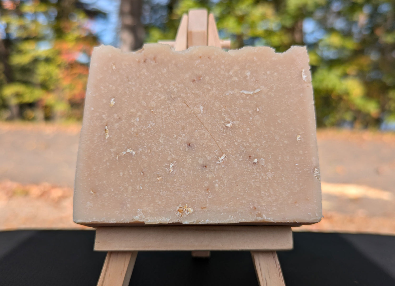 A handmade bar of soap made with fresh oatmeal and bee honey, and with additional oatmeal and honey fragrances. Oatmeal & Honey was made from 100% organic oils.